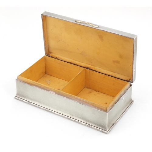 3229 - George V rectangular silver cigar box with hinged lid and engine turned decoration, by Adie Brothers... 