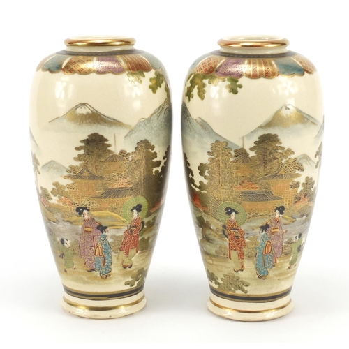 3215 - Pair of Japanese Satsuma pottery vases hand painted with figures in landscapes, character marks to t... 