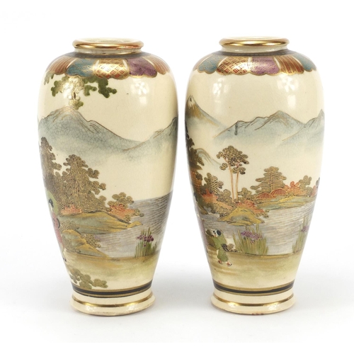 3215 - Pair of Japanese Satsuma pottery vases hand painted with figures in landscapes, character marks to t... 