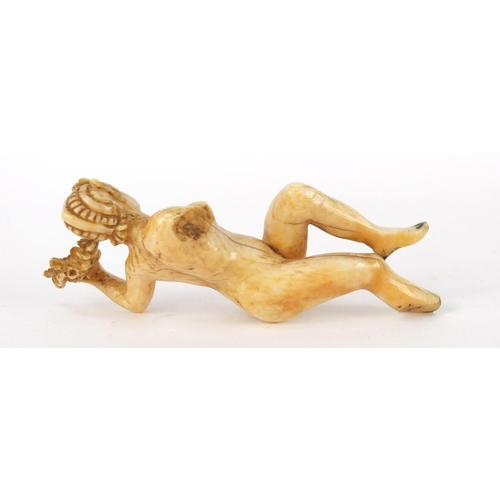 3993 - Antique ivory carving of a nude female holding a wreath, 8cm high