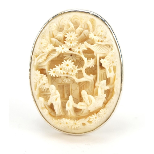 3572 - Chinese ivory panel carved with figures and pagodas, housed in an unmarked silver strut mount, 5cm h... 