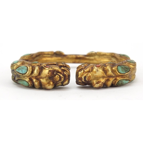 3836 - Tibetan gilt metal dragon bangle set with turquoise and coral, 8cm in diameter