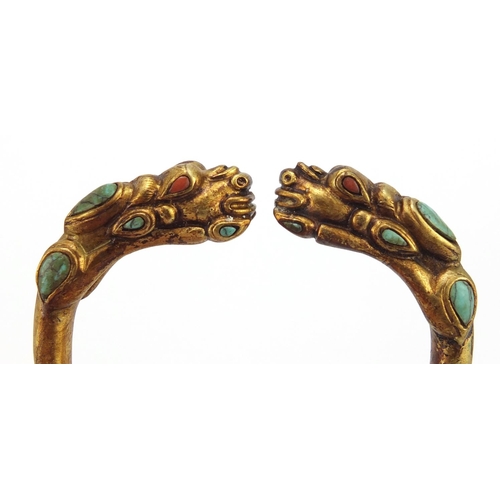 3836 - Tibetan gilt metal dragon bangle set with turquoise and coral, 8cm in diameter