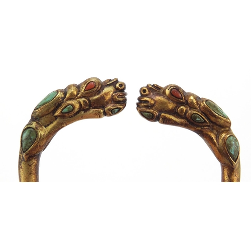 3836 - Tibetan gilt metal dragon bangle set with turquoise and coral, 8cm in diameter