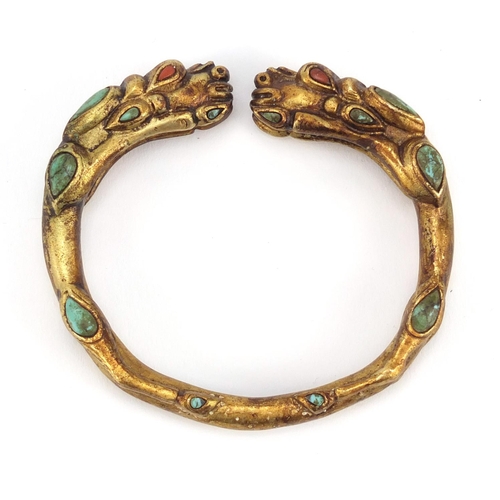 3836 - Tibetan gilt metal dragon bangle set with turquoise and coral, 8cm in diameter