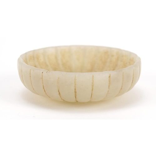 3039 - Chinese green jade flower head dish, 5.9cm in diameter