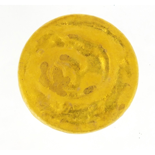 3392 - Chinese gold coloured metal scroll weight, impressed character marks, 6cm in diameter