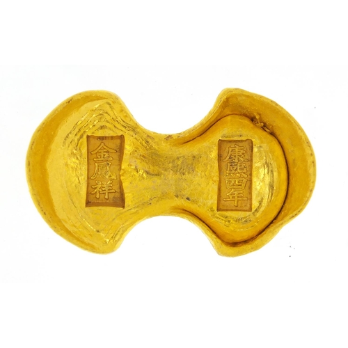 3802 - Chinese gold coloured metal scroll weight, impressed character marks, 7cm in diameter