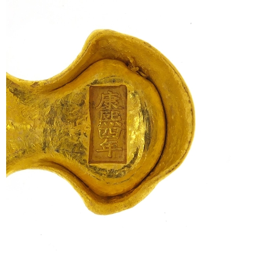 3802 - Chinese gold coloured metal scroll weight, impressed character marks, 7cm in diameter