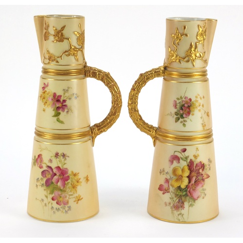 3274 - Pair of Royal Worcester blush ivory jugs with tapering bodies, each hand painted and gilded with flo... 