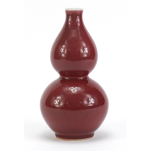 3951 - Chinese porcelain sang de boeuf glazed vase of double gourd form, 21.5cm high