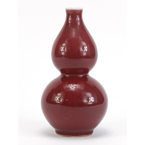 3951 - Chinese porcelain sang de boeuf glazed vase of double gourd form, 21.5cm high