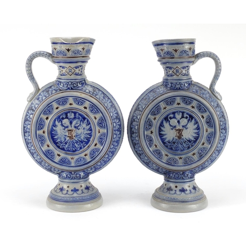 3372 - Pair of Bavarian salt glazed jugs, each numbered 566A to the bases, each 35.5cm high