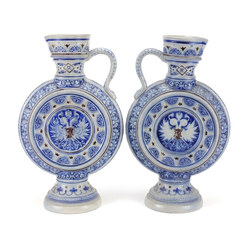 3372 - Pair of Bavarian salt glazed jugs, each numbered 566A to the bases, each 35.5cm high