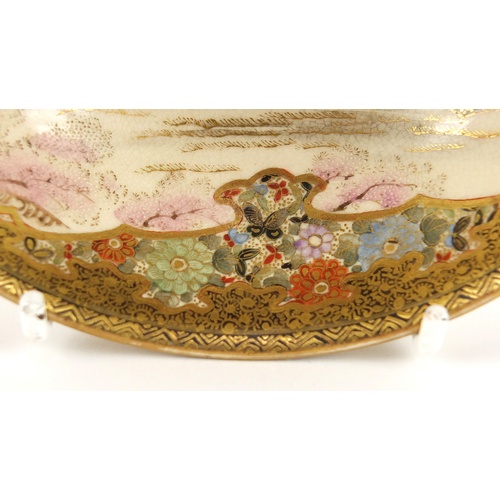 3214 - Japanese Satsuma pottery bowl, finely hand painted with figures in a landscape and flowers, four fig... 