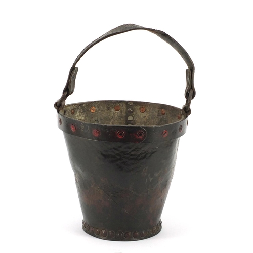 3175 - Antique leather fire bucket with metal rim and remnants of paint, 27cm high excluding the handle