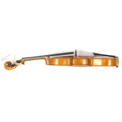 3462 - Old wooden violin with two bows having mother of pearl frogs and a fitted case, the violin back 14 i... 