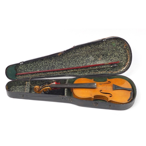 3462 - Old wooden violin with two bows having mother of pearl frogs and a fitted case, the violin back 14 i... 