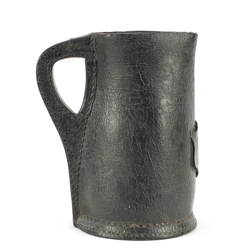 3001 - Large 17th century leather Black Jack jug with pewter cartouche engraved AF and dated 1671, 23.5cm h... 