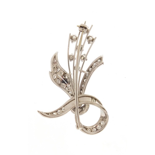 3099 - Good unmarked white metal and diamond floral spray brooch, 5cm in length, 11.5g