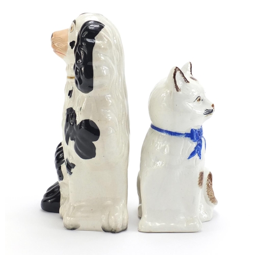 951 - Staffordshire pottery seated cat and a spaniel, the largest 26cm high