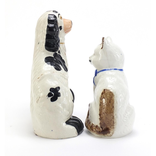 951 - Staffordshire pottery seated cat and a spaniel, the largest 26cm high