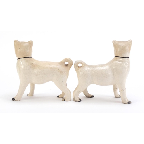 859 - Pair of Staffordshire pottery pug dogs, each 15cm in length