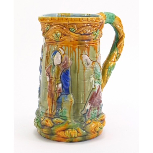 1180 - Victorian majolica jug decorated with figures, 25cm high