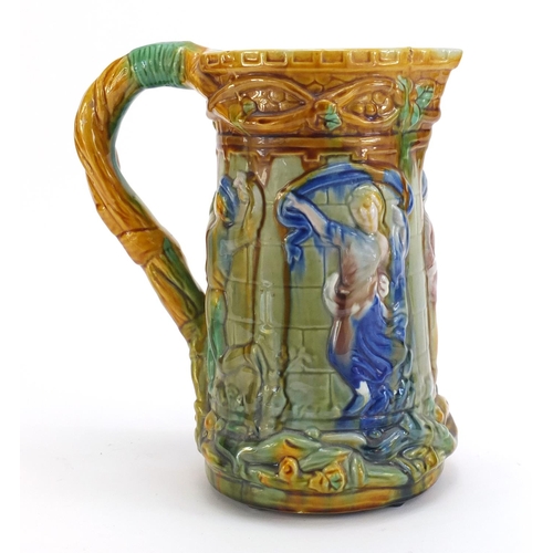 1180 - Victorian majolica jug decorated with figures, 25cm high