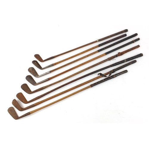 603 - Eight vintage wooden shafted golf clubs, the largest 96cm in length