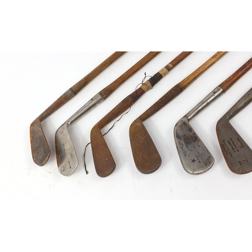 776 - Eight assorted wooden shafted golf clubs, the largest 100cm in length