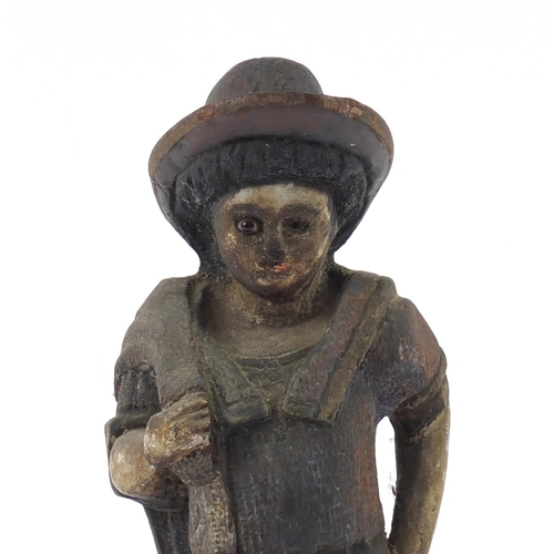 1448 - Polychrome painted wood carving of a farmer, 36cm high