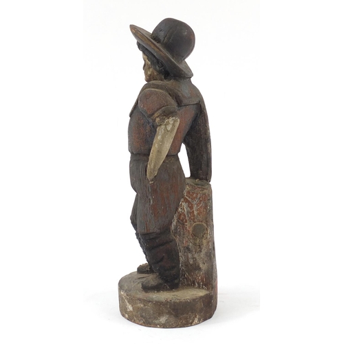 1448 - Polychrome painted wood carving of a farmer, 36cm high