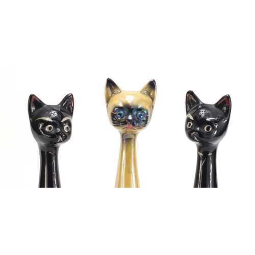 983 - Jema lustre pottery cat and two others, the largest 38cm high