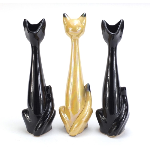 983 - Jema lustre pottery cat and two others, the largest 38cm high