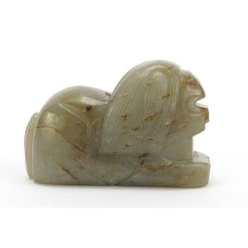 495 - Chinese green and russet jade carving of a lion, 7cm in length