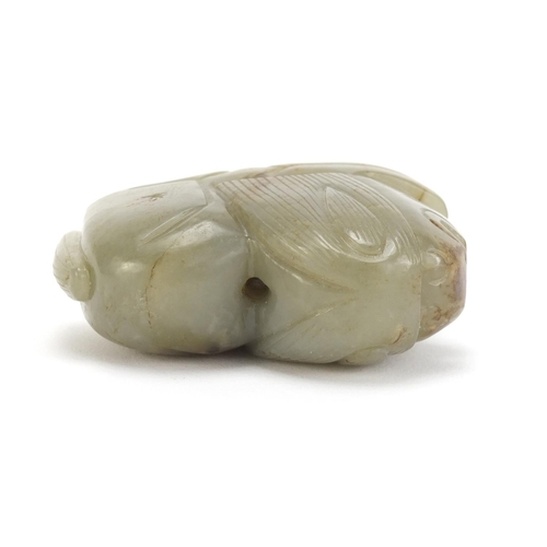 495 - Chinese green and russet jade carving of a lion, 7cm in length