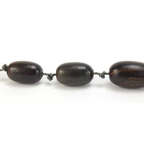 401 - Horn bead necklace, possibly rhinoceros horn, the largest bead 2.5cm wide