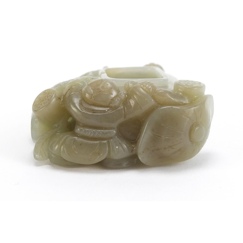 397 - Chinese russet green jade brush washer carved with two children a mythical lion and a butterfly, 7.5... 