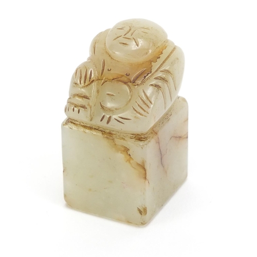 313 - Chinese green and russet jade desk seal carved with a Buddha, 4.3cm high