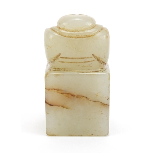 313 - Chinese green and russet jade desk seal carved with a Buddha, 4.3cm high