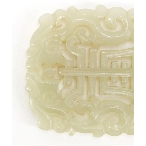 311 - Chinese pale green jade panel pierced and carved with two dragons and a bat, 6.5cm x 5cm