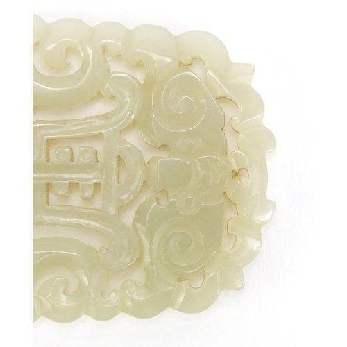 311 - Chinese pale green jade panel pierced and carved with two dragons and a bat, 6.5cm x 5cm