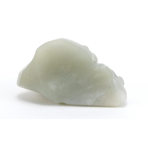 837 - Chinese pale green jade carving of a figure beside a tree before a mountain, 6cm high