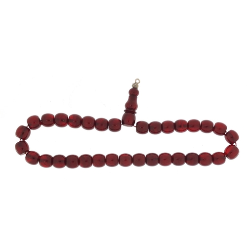 533 - Islamic cherry amber coloured prayer bead necklace, 38cm in length