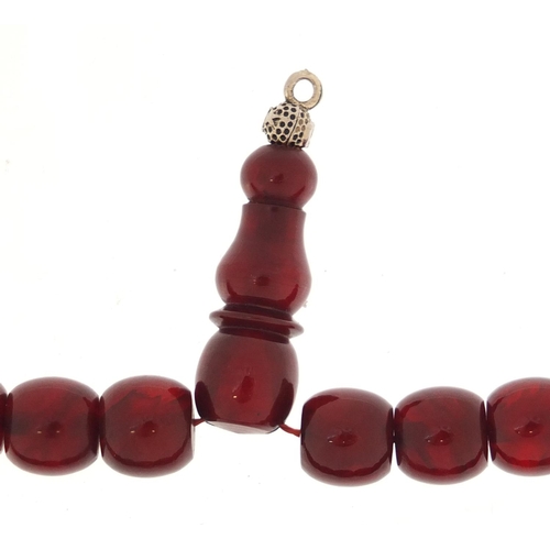 533 - Islamic cherry amber coloured prayer bead necklace, 38cm in length