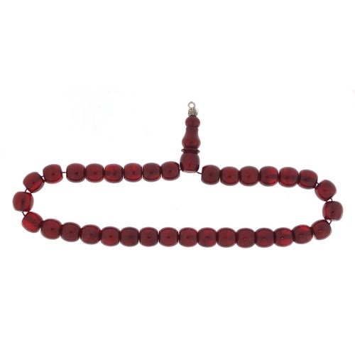 533 - Islamic cherry amber coloured prayer bead necklace, 38cm in length