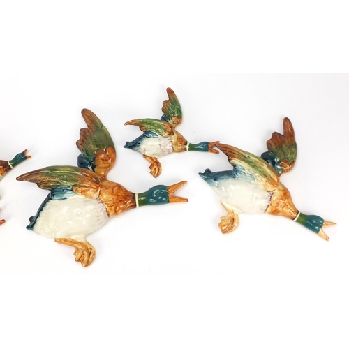 136 - Graduated set of five Beswick mallard wall plaques, the largest 30cm wide