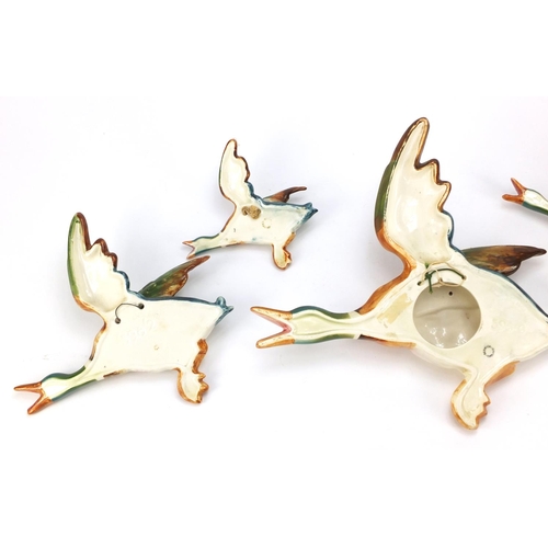 136 - Graduated set of five Beswick mallard wall plaques, the largest 30cm wide