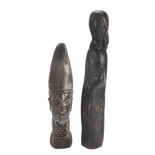 1509 - Four wood carvings including two tribal face masks, the largest 49.5cm high